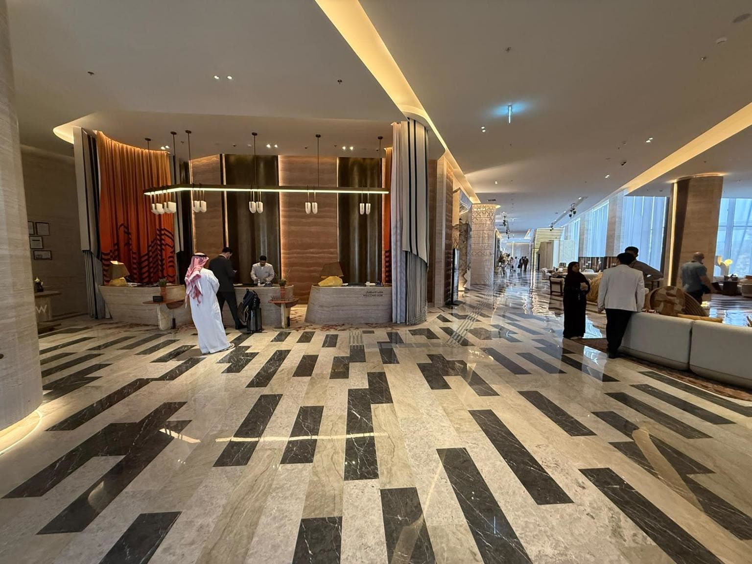 W Riyadh KAFD lobby reception with black and travertine marble floor