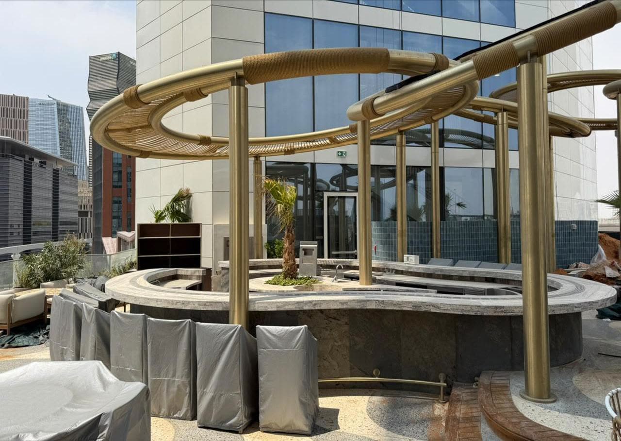 Sahari's bronze ring pergola structure